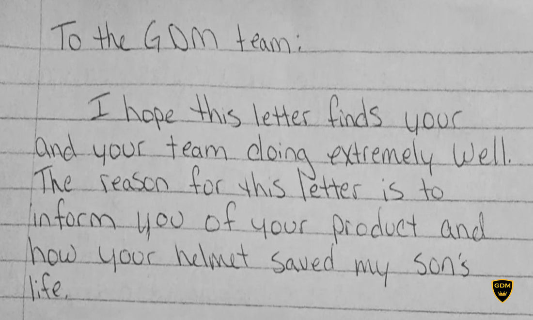 Handwritten letter to the GDM team resting on a GDM motorcycle helmet