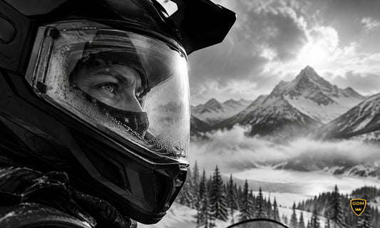GDM dual sport snowmobile helmet in matte black on a snowy trail